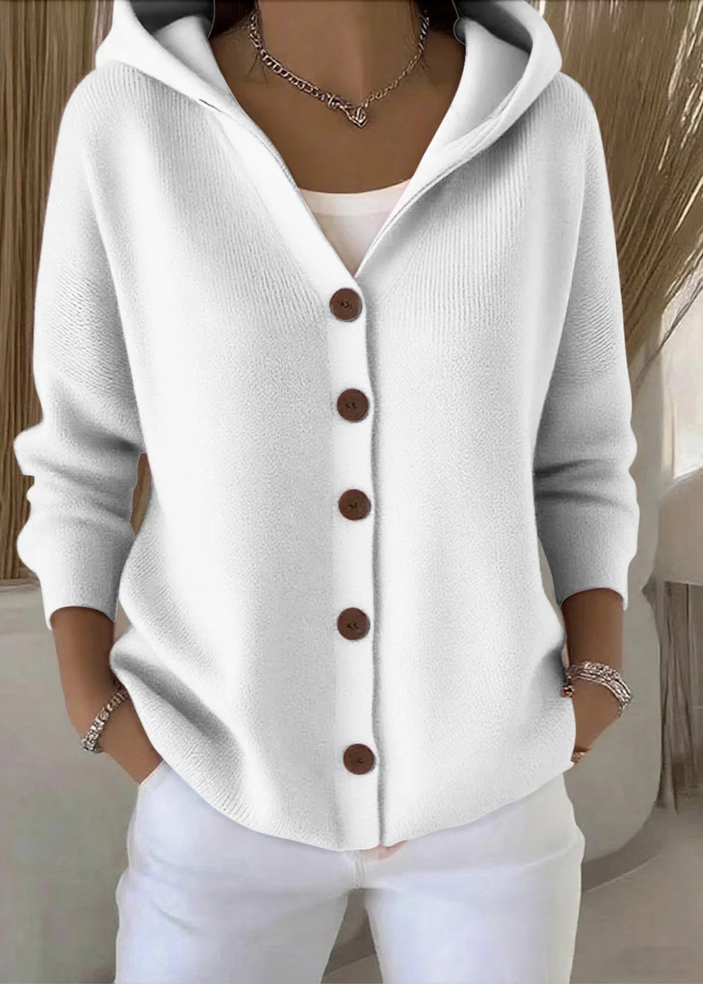 Soft women's knit sweater cardigan with hood. Comfortable and chic for casual or elegant outfits.