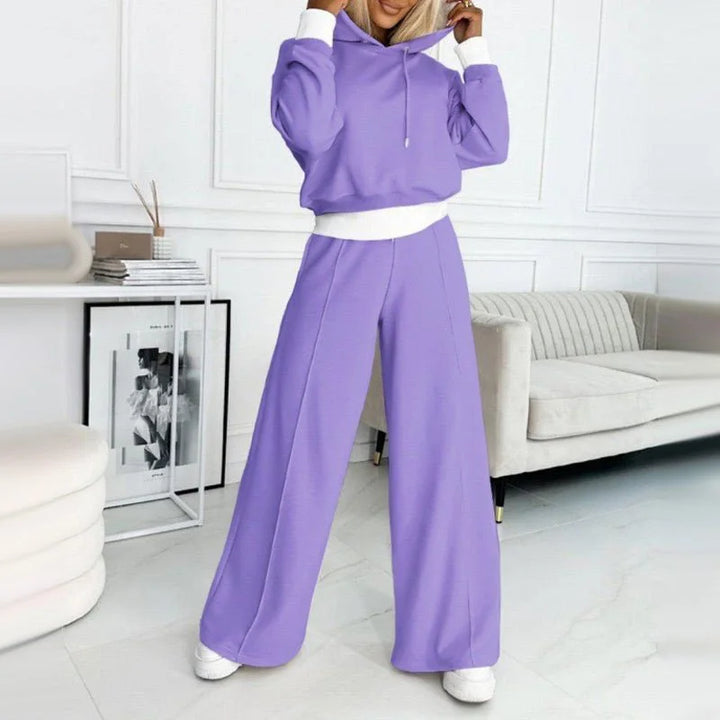 Soft textured women's cozy knit lounge set featuring a hooded top and wide-leg pants.