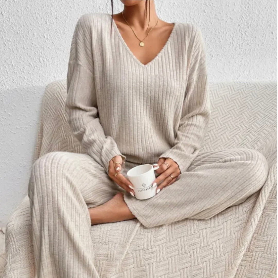 Women's cozy knit loungewear set with V-neck top & wide leg pants, perfect for relaxation.
