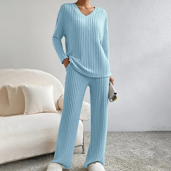 Women's two-piece knit loungewear set, cozy V-neck top and comfortable wide leg pants.