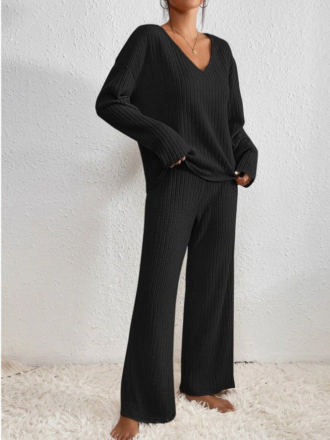 Relax in this women's knit loungewear set: soft V-neck top and comfortable wide leg pants.