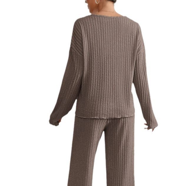 Women's comfortable knit two-piece loungewear set with V-neck top & wide leg pants.