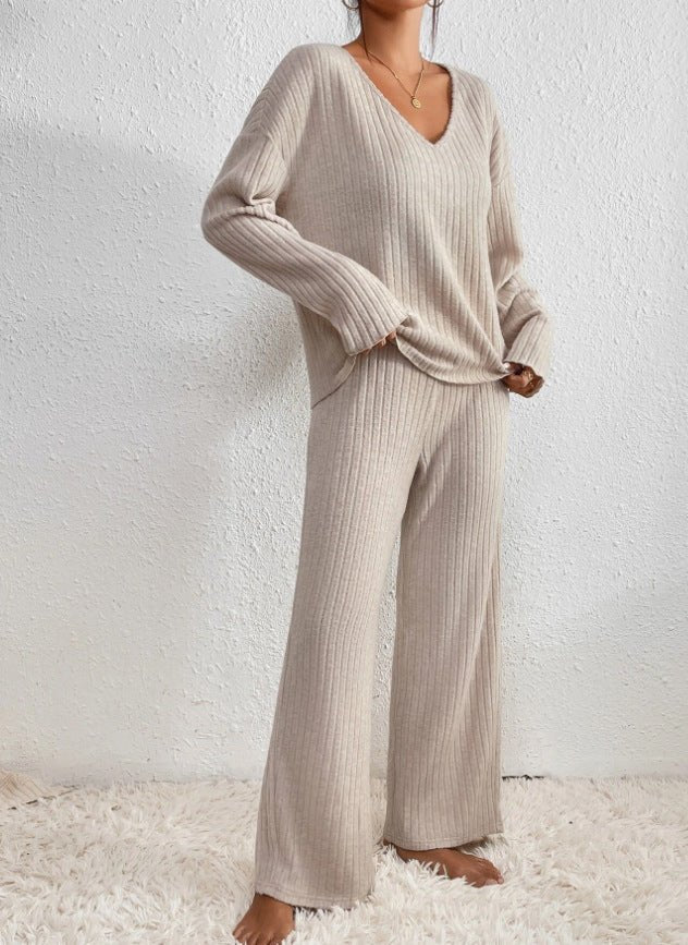 Soft women's knit loungewear, featuring a V-neck top and flowy wide leg pants for relaxation.