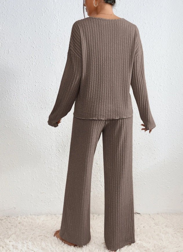 Elegant women's knit loungewear set, V-neck top and wide leg pants for cozy casual wear.