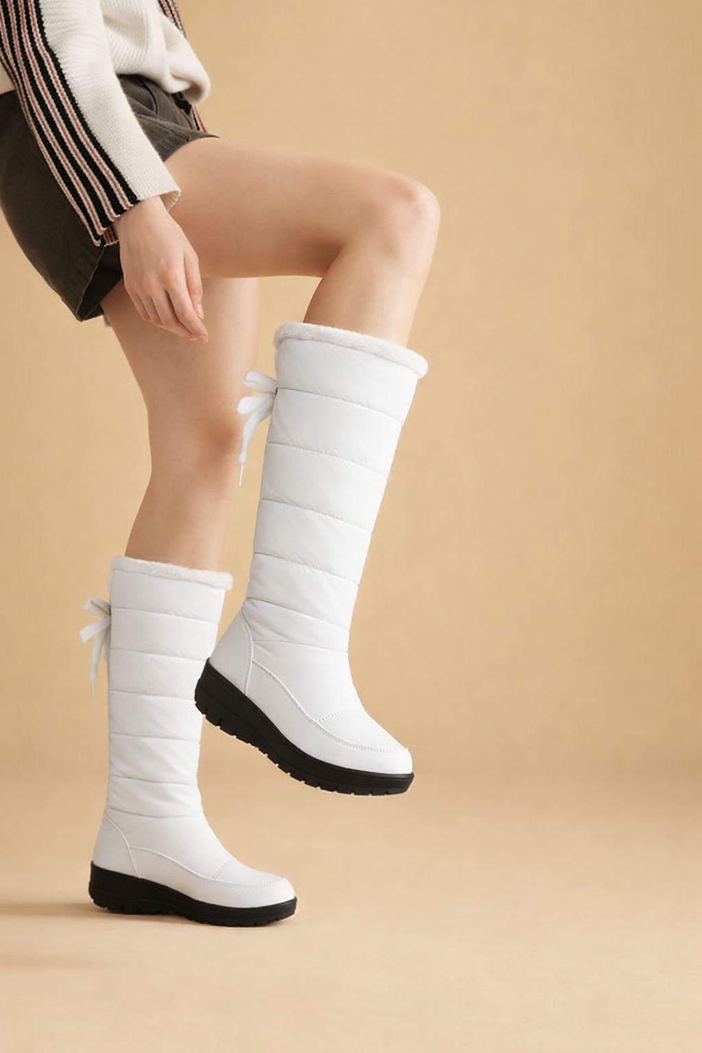 Elegant women's winter booties with secure lace-up design, offering warmth and comfort for cold days.