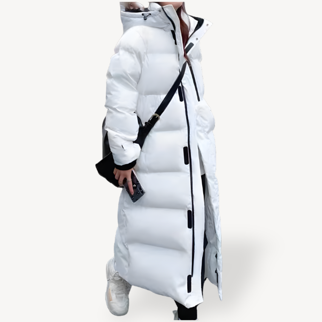 Stylish women's oversized long puffer jacket, perfect for cold winter days. Features a warm hood and cozy fit.