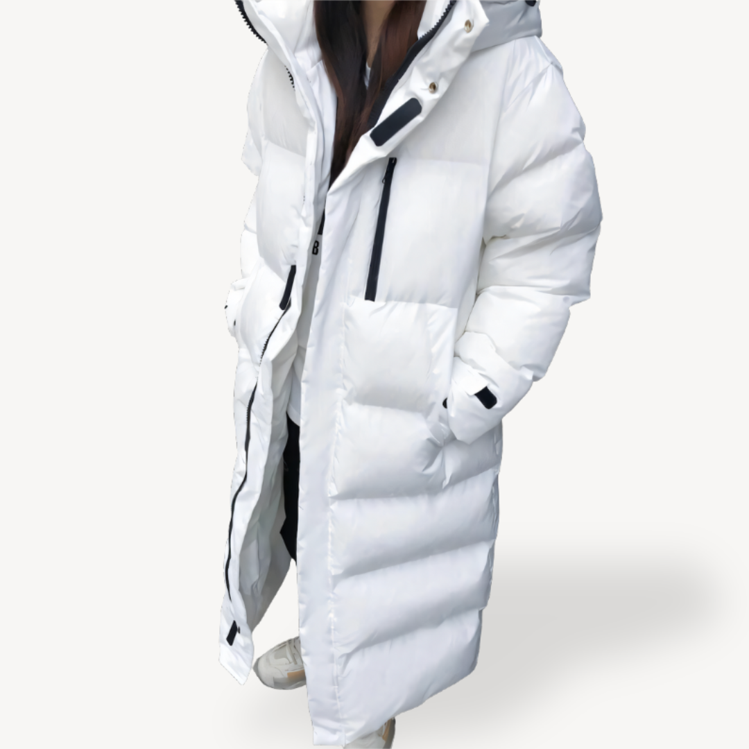 Oversized women's long puffer coat, designed for maximum winter warmth and comfort. A stylish hooded quilted jacket.