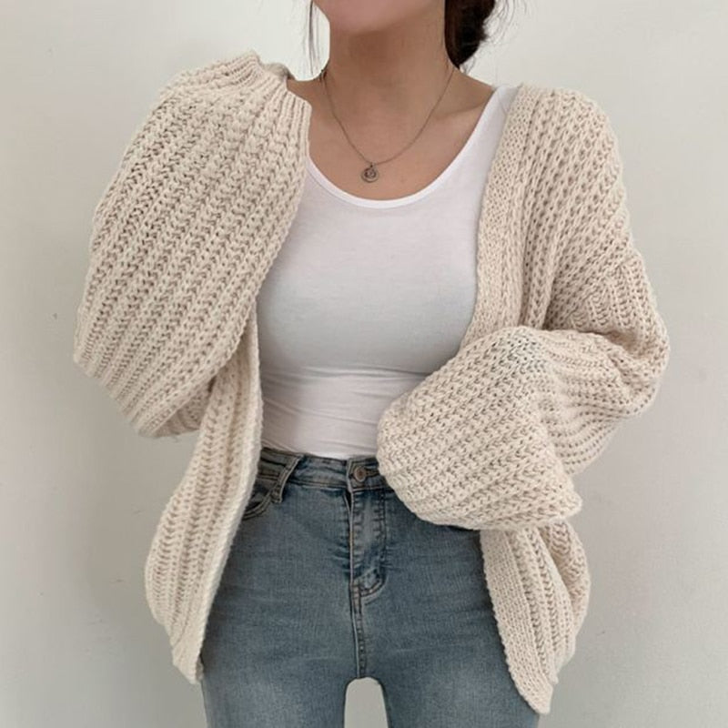 Stylish women's open front cardigan, featuring voluminous balloon sleeves, a versatile layering piece.