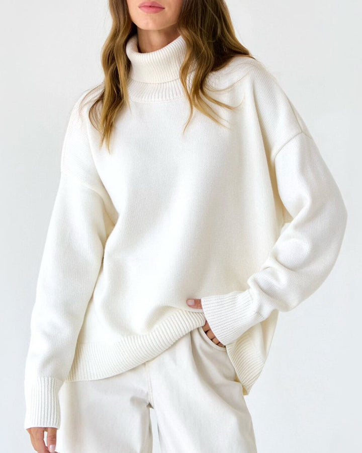 Women's cozy oversized roll neck jumper in soft knit, perfect for stylish winter comfort.