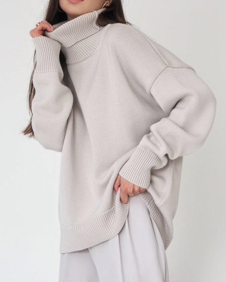 Soft knit women's oversized turtleneck sweater, perfect for cozy winter layering.