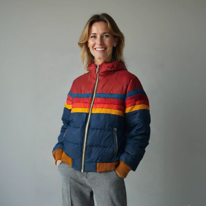 Women's cozy quilted puffer jacket in a stylish blue, featuring a warm hood & practical front pockets.
