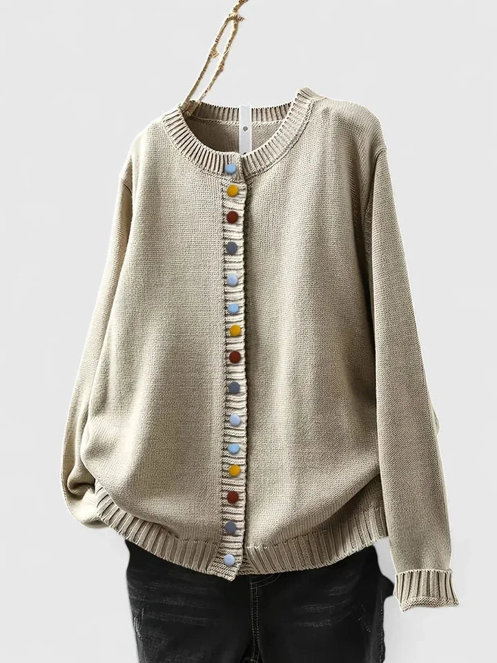 Women's cozy relaxed-fit cardigan sweater with vibrant multi-color buttons, ideal for fall layering.