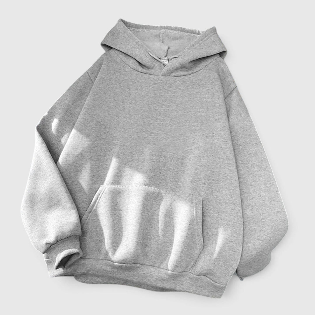 Drawstring hood on women's relaxed fit pullover hoodie. Cozy and oversized with a warm kangaroo pocket.