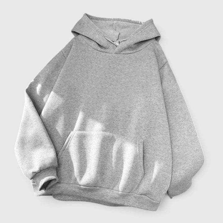 Drawstring hood on women's relaxed fit pullover hoodie. Cozy and oversized with a warm kangaroo pocket.