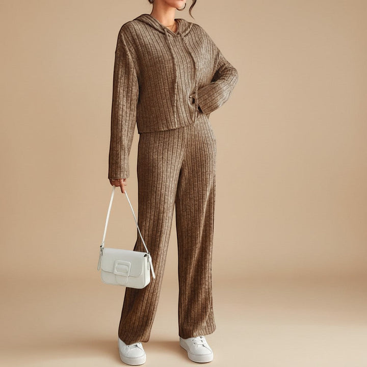 Stylish women's two-piece ribbed knit set with a comfortable hoodie and relaxed fit pants. Ideal casual wear.