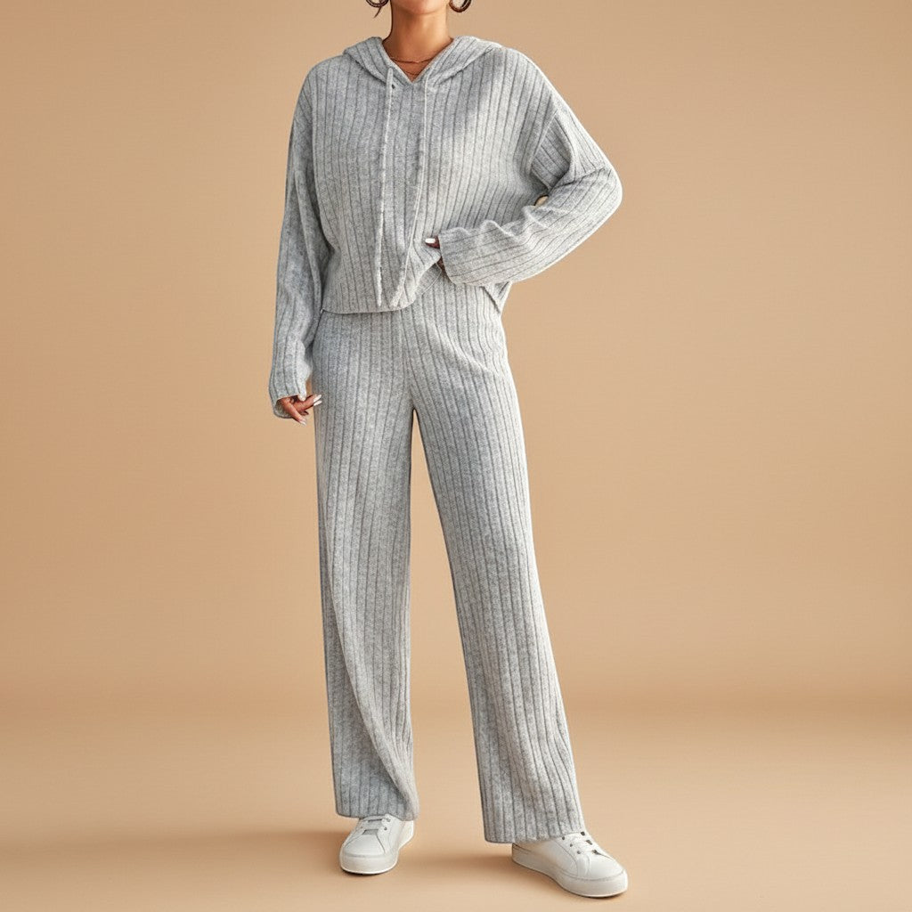 Soft ribbed knit women's set featuring a cozy hoodie and matching relaxed pants for ultimate comfort & style.