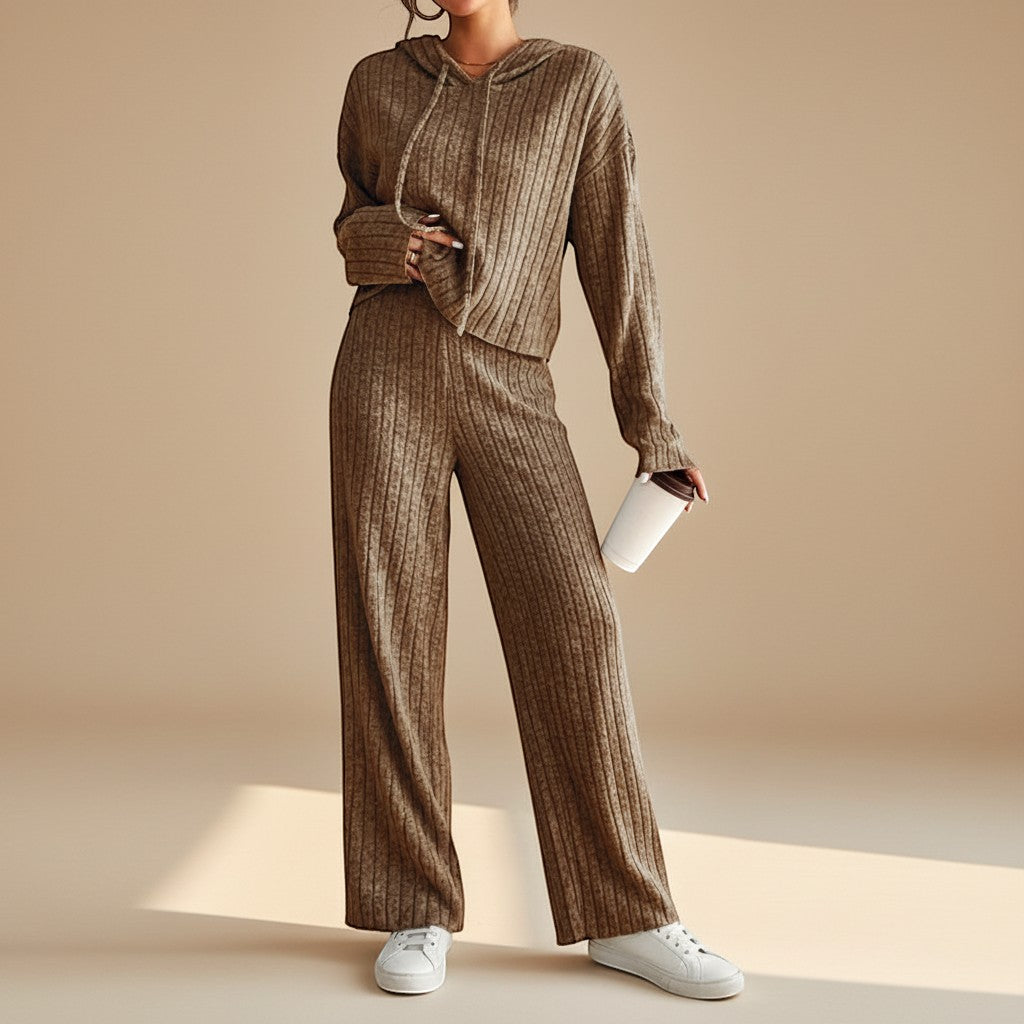Women's ribbed knit loungewear set with a warm hoodie and relaxed fit pants, perfect for cozy comfort at home.