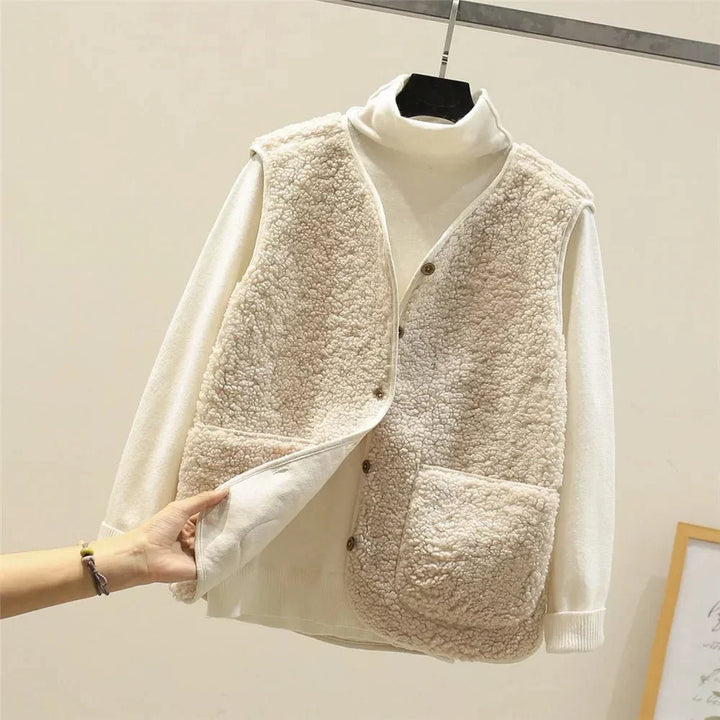 Stay warm in this women's cozy sleeveless vest, lightweight & comfortable for easy layering.