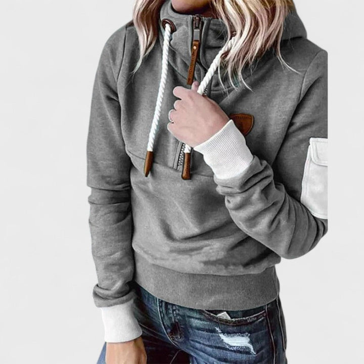 Plush, cozy women's jumper featuring a modern zip neckline. Soft knit long sleeve for ultimate comfort.