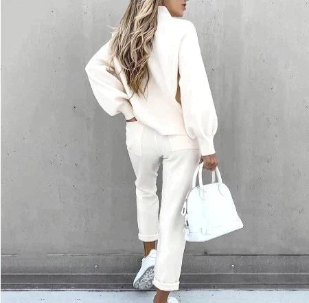 Relaxed fit women's two-piece loungewear with cozy sweater top and comfortable drawstring waist pants.