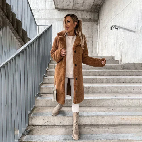 Chic women's cozy teddy bear coat, button-front, notched collar, perfect for cold weather.