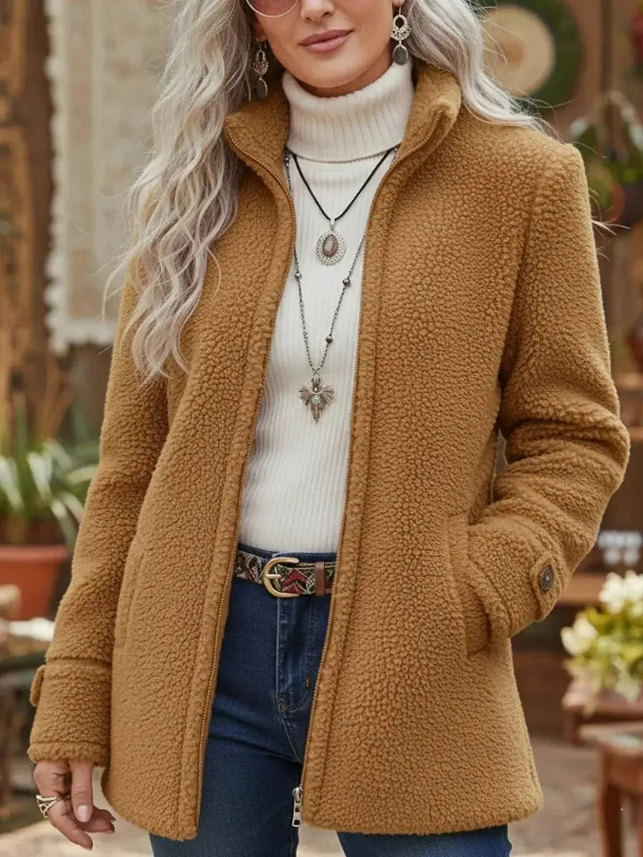 Soft fleece teddy coat for women. Zip-up outerwear with stand collar for cozy winter warmth & everyday style.