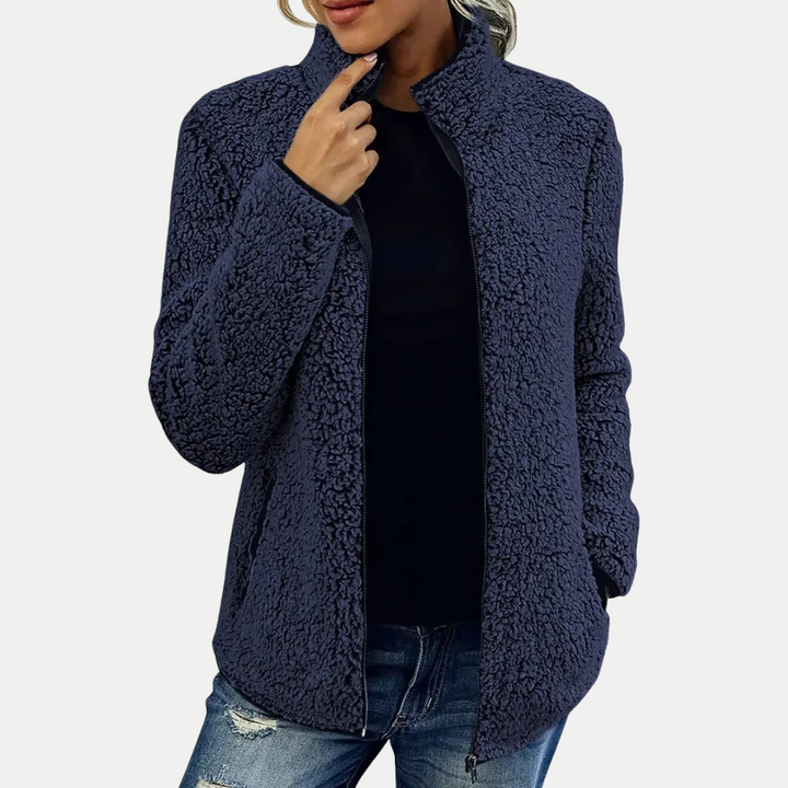 Active women's textured zip-up jacket, perfect for casual outings or layering as a warm fall fashion piece.