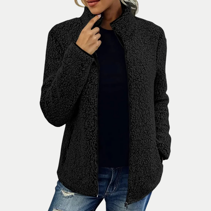 High-quality women's textured fleece zip jacket with a stylish high collar, designed for ultimate comfort & warmth.
