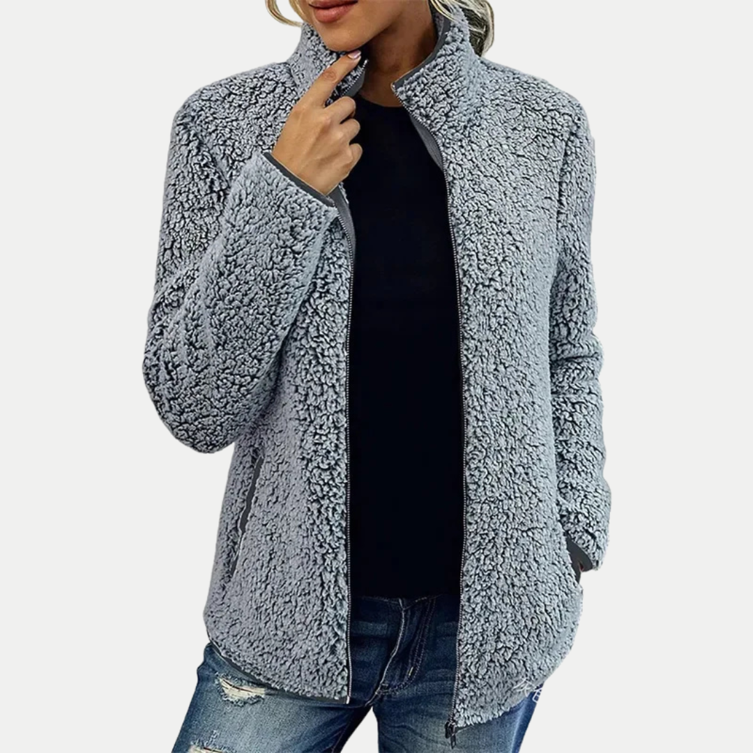 Versatile women's textured zip-up fleece jacket, suitable for casual everyday wear or as a warm fall/winter layer.