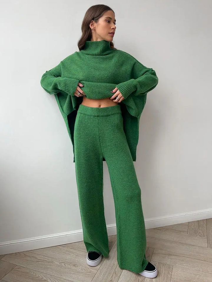 Loose fit women's cozy turtleneck top paired with comfortable wide leg trousers. Relaxed, stylish loungewear.