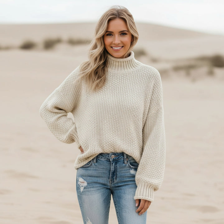 Chic women's winter style sweater. Long sleeve, warm turtleneck pullover, relaxed fit comfort.