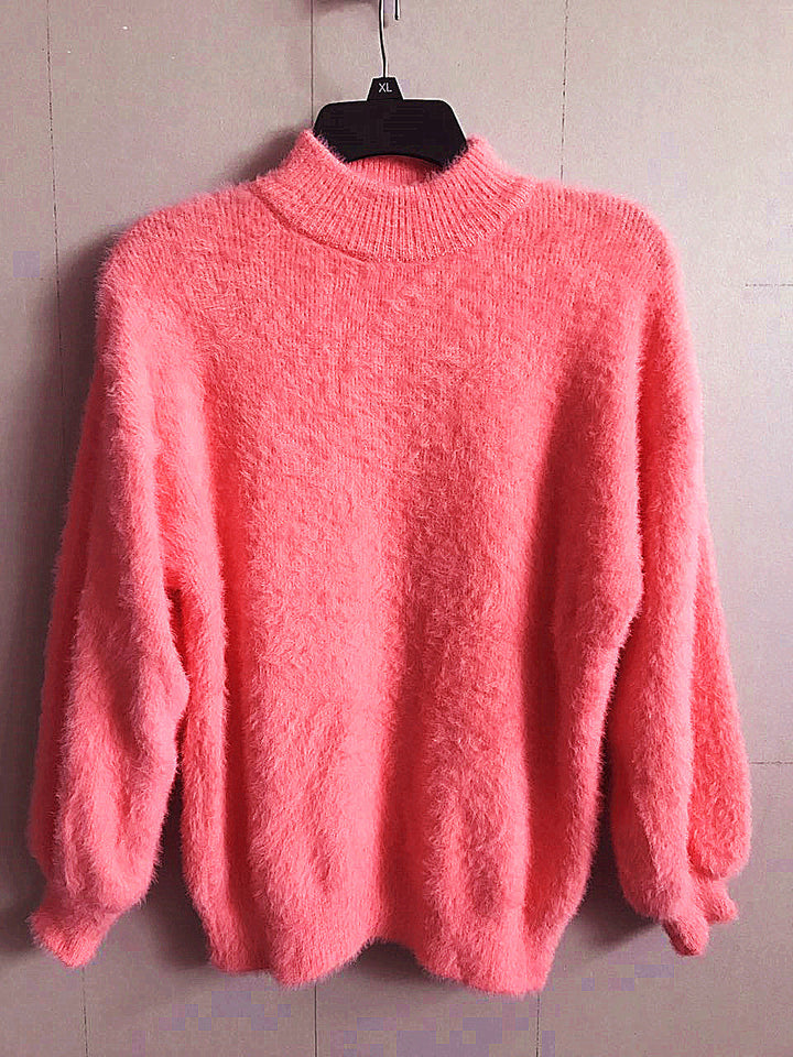 Chic women's cozy turtleneck sweater, a versatile long sleeve knit for elegant and warm winter fashion.