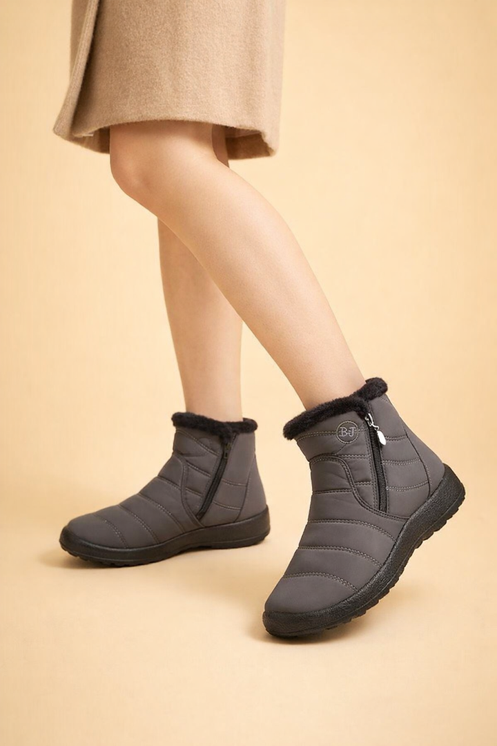 Stay warm & dry in women's waterproof winter snow boots, featuring cozy lining & non-slip grip.