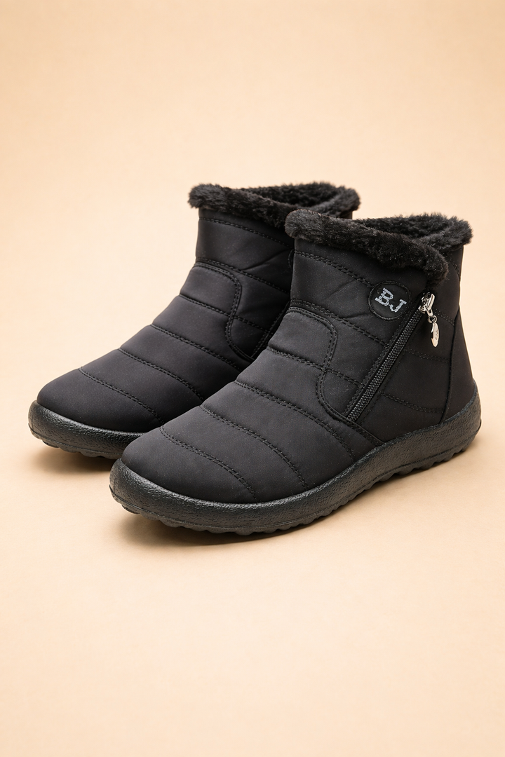 Waterproof women's snow boots with cozy lining & non-slip sole for secure, warm comfort in winter.