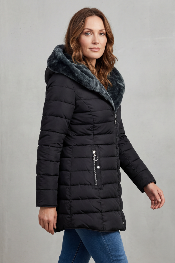 Warm women's winter parka, ideal for extreme cold weather, offering cozy protection. Durable outerwear.