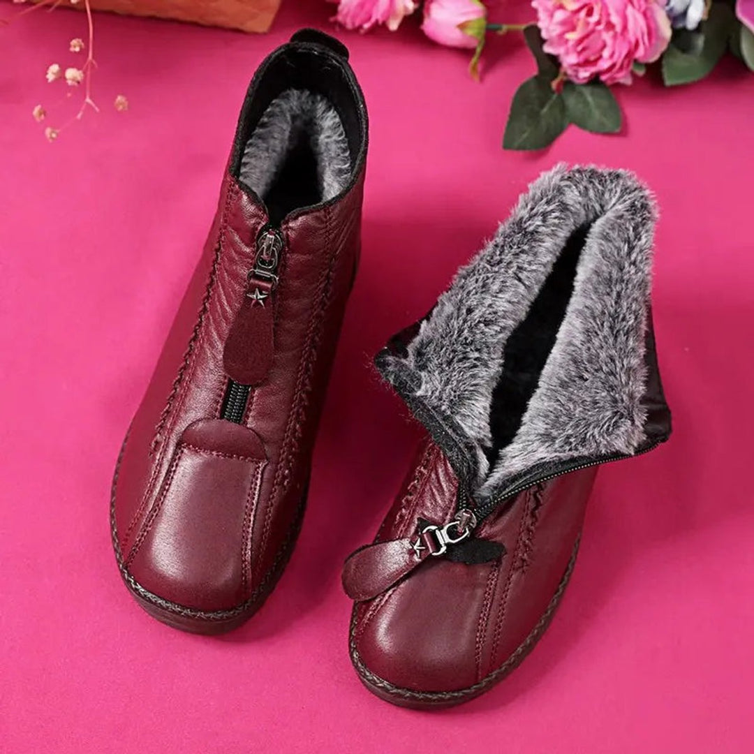 Women's cozy zip-up ankle boots, perfect for winter. Slip-resistant sole & waterproof for cold weather.
