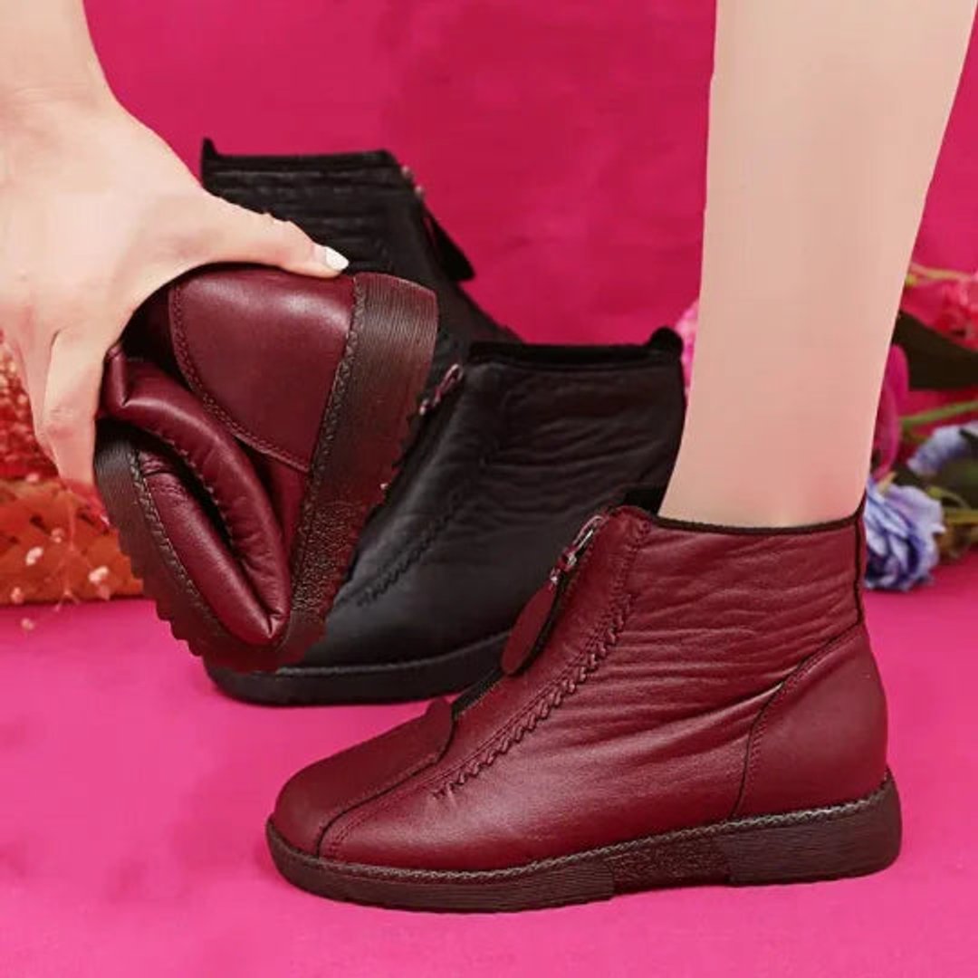 Slip-resistant waterproof women's ankle boots. Cozy zip-up design for cold weather protection & warmth.
