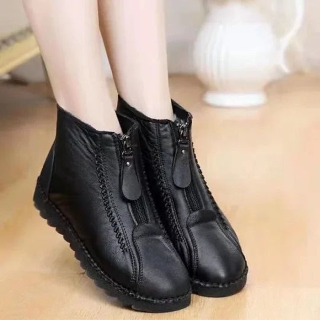 Cozy women's winter ankle boots with a convenient zip-up closure. Slip-resistant sole for everyday wear.