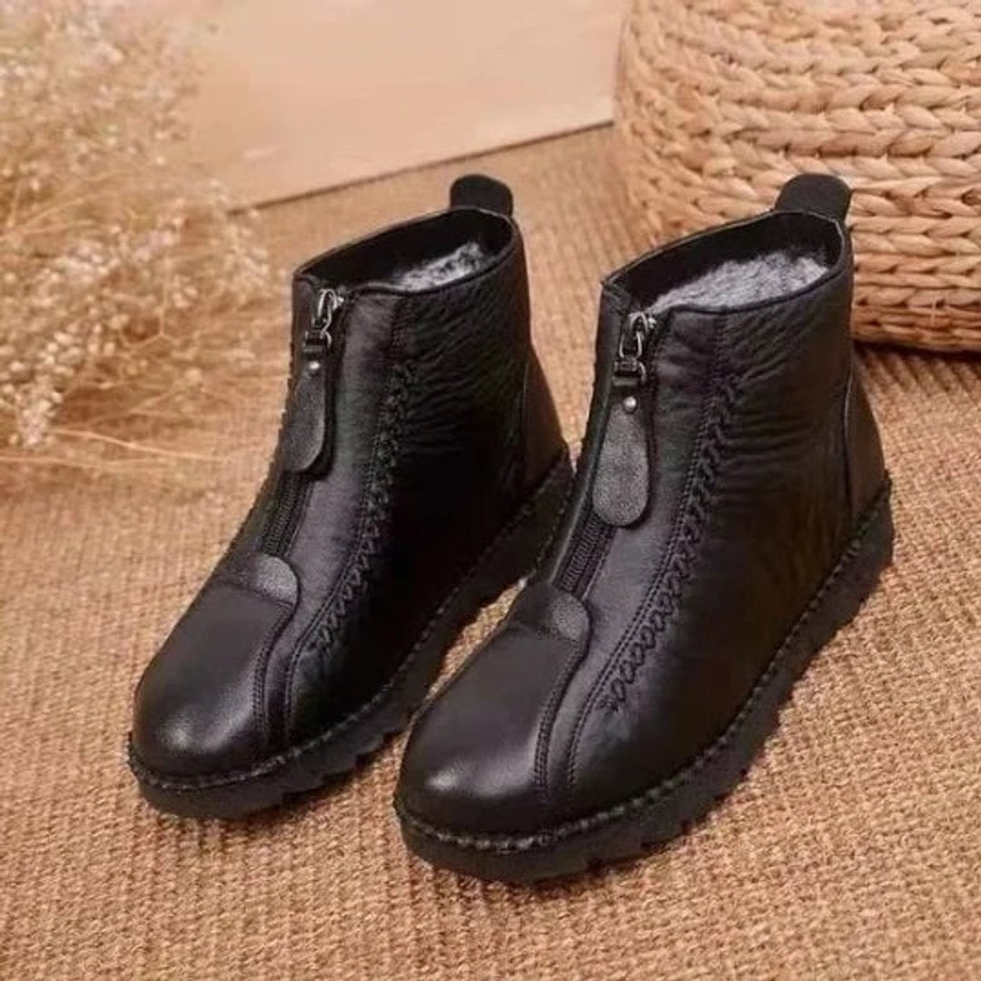 Waterproof women's winter ankle boots. Cozy zip-up style with slip-resistant sole for snowy cold weather.