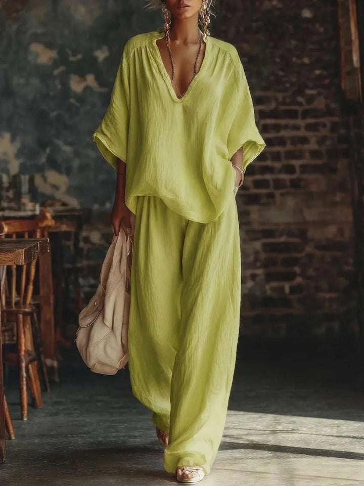 Women's casual crinkled two-piece set with a plunging neckline and fashionable loose wide-leg trousers.