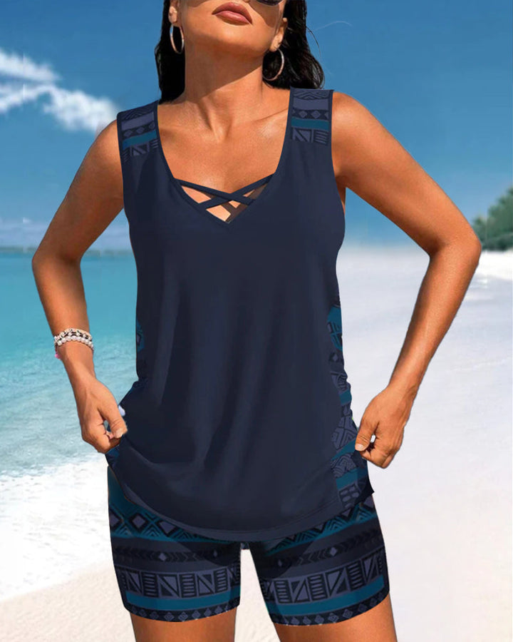 Chic women's printed tankini two-piece with a trendy criss cross neckline, great for poolside fashion.