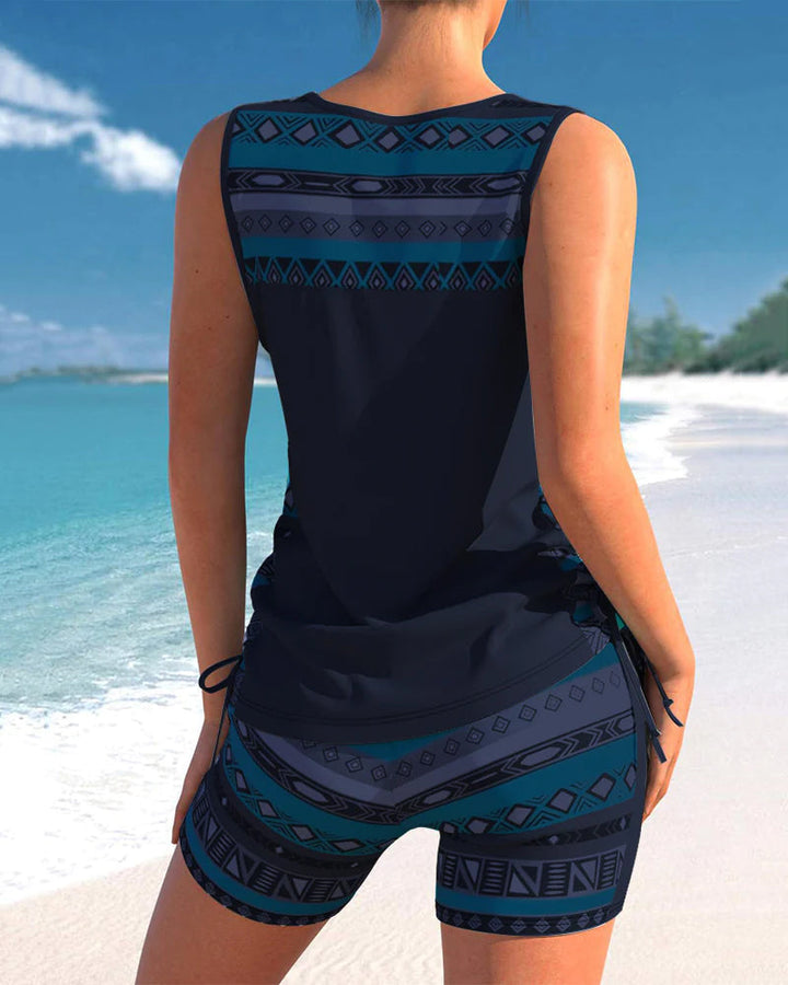 Detailed view of the abstract print on women's criss cross tankini two-piece swimwear.