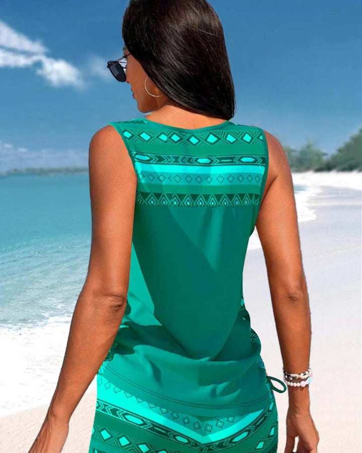 Vibrant printed tankini top and matching bottoms; women's two-piece criss cross swimwear.