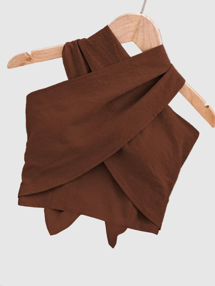 Ladies' elegant crisscross halter top, a must-have for summer fashion. Comfortable and stylish casual warm weather wear.