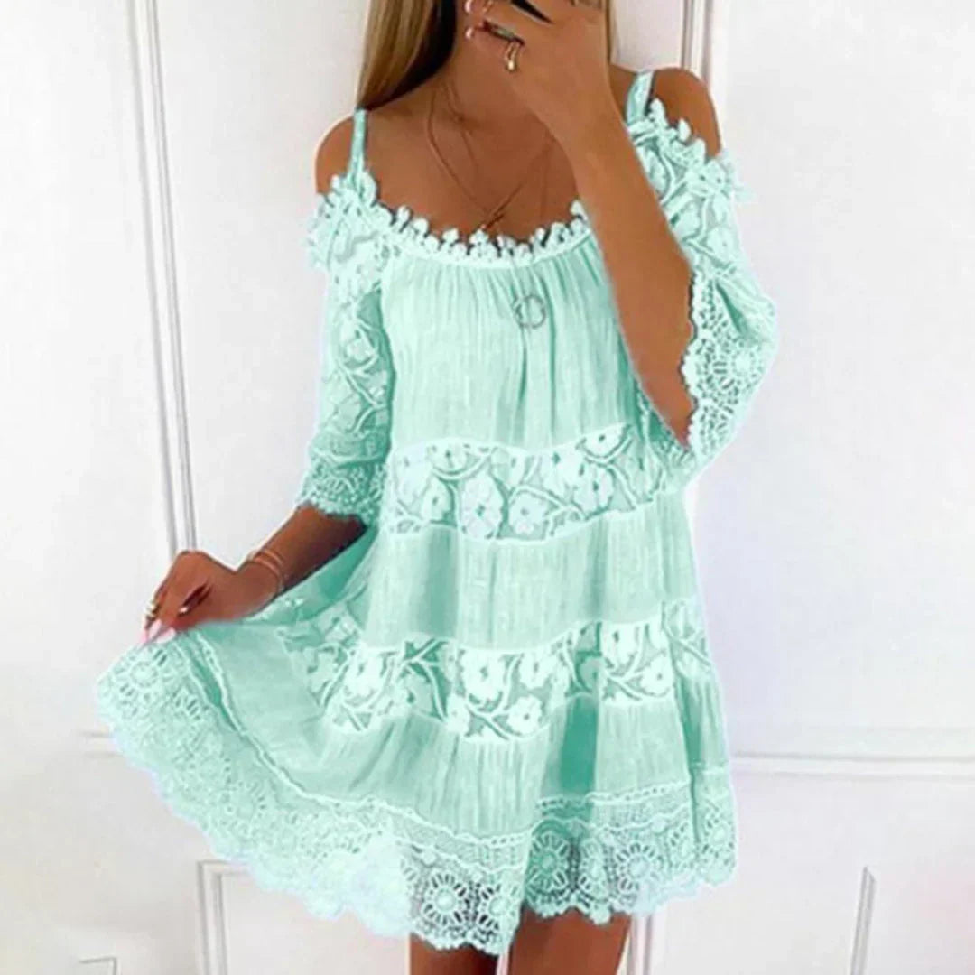 Women's crochet lace embroidered mini dress, perfect for summer. Features cold shoulder and a loose fit.