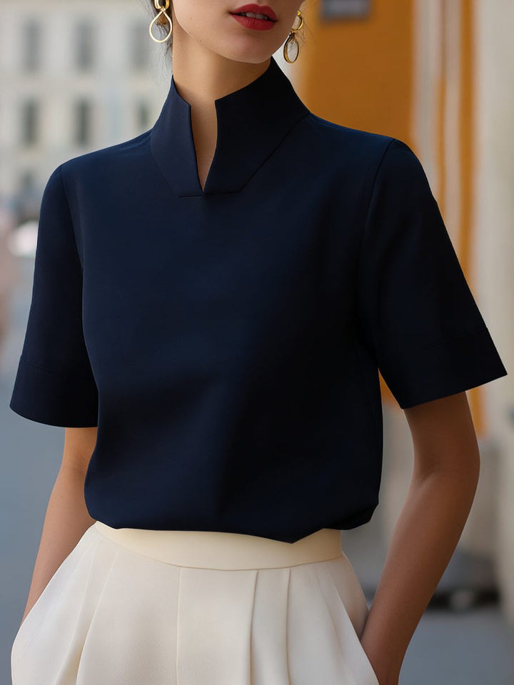 Lightweight women's cropped blouse, short sleeve, stand collar, a chic and modern top for summer fashion.