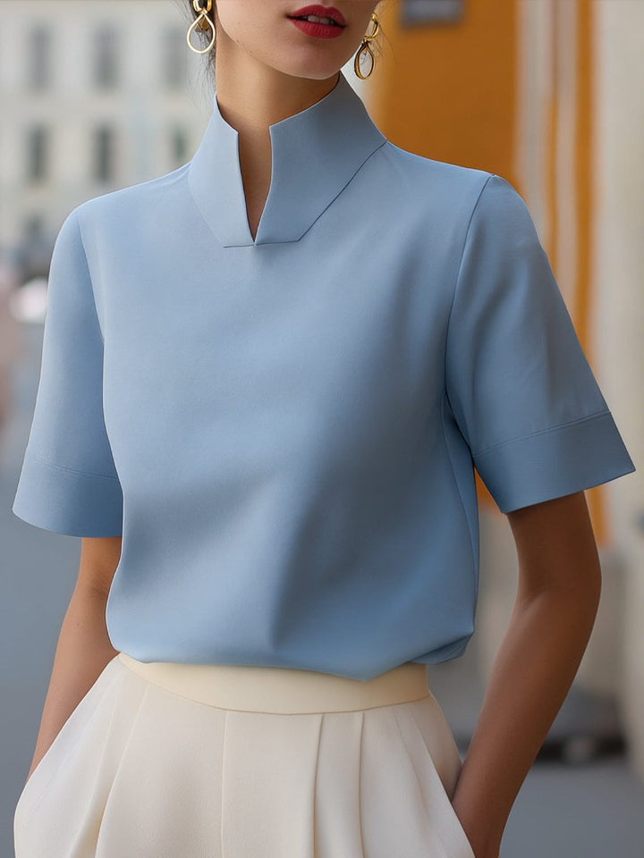 Fashionable women's cropped top, a short sleeve blouse with a chic stand collar, perfect for warm weather.