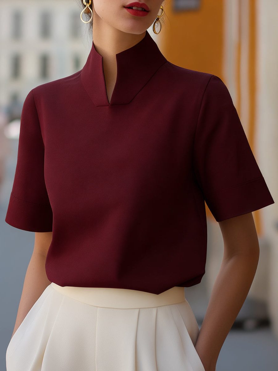 Versatile women's short sleeve cropped blouse, featuring a stand collar; elegant and modern casual wear.