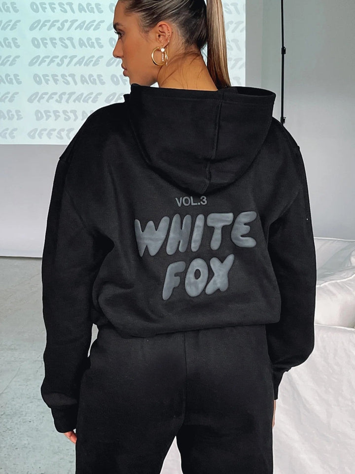 Stylish women's cropped tracksuit set, a two-piece activewear look with a unique back print design.