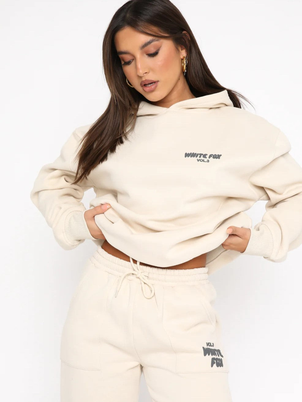 Trendy women's casual cropped tracksuit, two-piece athleisure set for comfort, unique back print.